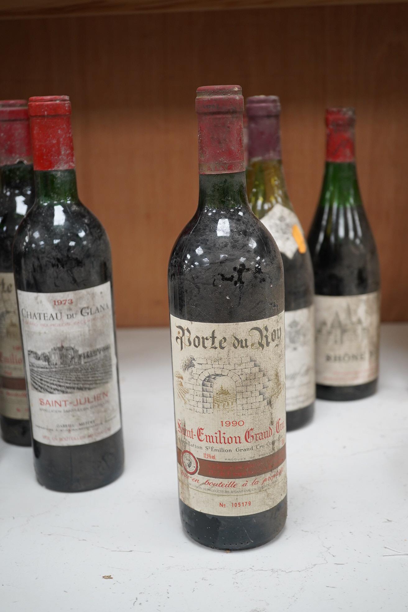 Eleven bottles of red wine to include two bottles of Porte du Roy, St-Emilion Grand Cru, 1990 and a bottle of Chateauneuf du Pape 1981 & 1982. Condition - storage unknown